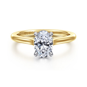 Gabriel & Co. ER16339O4M44JJ 14 karat white and yellow gold Classic engagement ring, front view of an oval center on four prongs, with the band tapering up toward the head