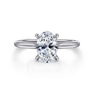 Gabriel & Co. ER16339O6W44JJ 14 karat white gold Classic engagement ring, front view of an oval center in four teardrop tipped claws on a plain smooth band