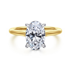 Gabriel & Co. ER16339O8M44JJ 14 karat white and yellow gold Classic engagement ring, front view of an oval center in rounded tip prongs on a plain band with rising shoulders