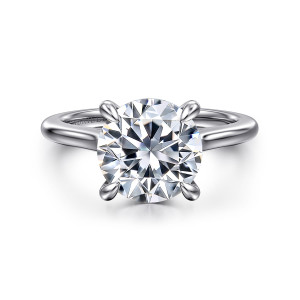 Gabriel & Co. ER16339R12W44JJ 14 karat white gold Classic engagement ring, front view of a round center on four claws over a smooth band that swells toward the head