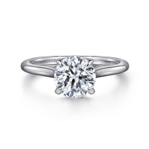 Gabriel & Co. ER16339R6W44JJ 14 karat white gold Classic engagement ring, front view of a round center in claw prongs on a slim smooth band with no stones