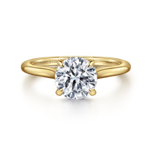 Gabriel & Co. ER16339R6Y44JJ 14 karat yellow gold Classic engagement ring, front view of a round center in four claws on plain shoulders that curve up to it