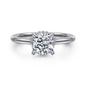 Gabriel & Co. ER16340C6W44JJ 14 karat white gold Classic engagement ring, front view of a cushion cut center with tiny diamonds glinting at the edges of the head