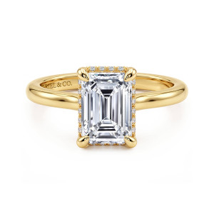 Gabriel & Co. ER16340E8Y44JJ 14 karat yellow gold Classic engagement ring, front view of an emerald cut center with corner prongs and a thin line of small diamonds