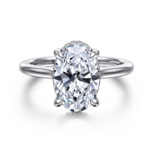 Gabriel & Co. ER16340O12W44JJ 14 karat white gold Classic engagement ring, front view of an oval center held by rounded prongs on a smooth polished band