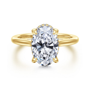 Gabriel & Co. ER16340O12Y44JJ 14 karat yellow gold Classic engagement ring, front view of an oval center with rounded prongs and a fine line of stones at its edge