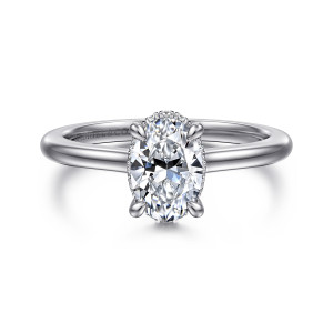 Gabriel & Co. ER16340O4W44JJ 14 karat white gold Classic engagement ring, front view of an oval center with rounded prong tips and a thin edge of stones behind it
