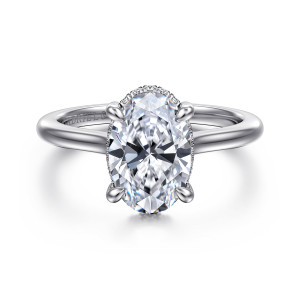 Gabriel & Co. ER16340O8W44JJ 14 karat white gold Classic engagement ring, front view of an oval center with prongs and a thin line of stones at the seat's edge