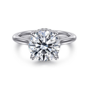 Gabriel & Co. ER16340R12W44JJ 14 karat white gold Classic engagement ring, front view of a round center with a few small diamonds showing past its edge