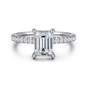 Gabriel & Co. ER16349E6W44JJ 14 karat white gold Classic engagement ring, front view of an emerald cut center in claw prongs with round diamonds along the shoulders
