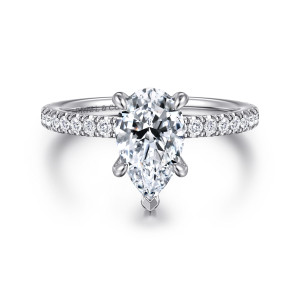 Gabriel & Co. ER16349P6W44JJ 14 karat white gold Classic engagement ring, front view of a pear shaped center with a V tip and small diamonds along both shoulders
