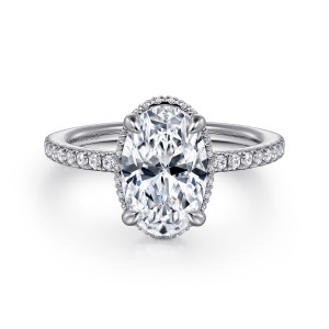 Gabriel & Co. ER16350O8W44JJ 14 karat white gold Contemporary engagement ring, front view of an oval center with claw prongs and a fine line of stones at its edge