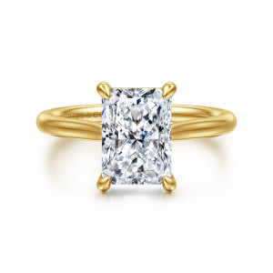 Gabriel & Co. ER16355N10Y4JJJ 14 karat yellow gold Contemporary engagement ring, front view of a radiant cut center gripped at its corners by teardrop tipped prongs