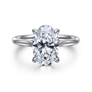 Gabriel & Co. ER16355O12W4JJJ 14 karat white gold Contemporary engagement ring, front view of the long oval center between four teardrop tipped claws on a smooth unset band