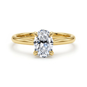 Gabriel & Co. ER16355O5Y4JJJ 14 karat yellow gold Contemporary engagement ring, front view of an oval center in four teardrop tipped prongs above smooth shoulders and a plain band