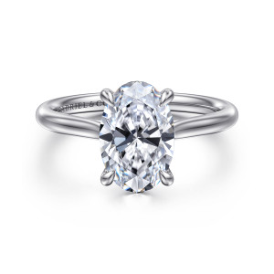 Gabriel & Co. ER16355O8W4JJJ 14 karat white gold Contemporary engagement ring, front view of the oval center with four teardrop tipped prongs above a smooth polished band