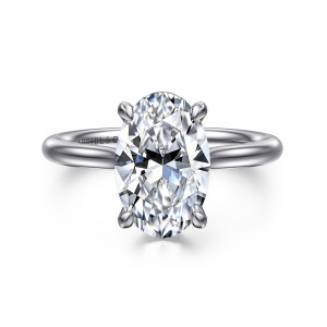 Gabriel & Co. ER16356O12W44JJ 14 karat white gold Classic engagement ring, front view of an oval center held by four prongs above a slim, plain band