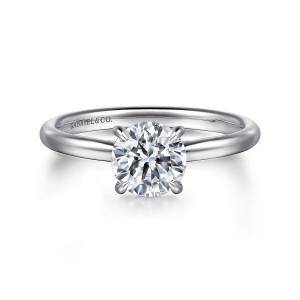 Gabriel & Co. ER16356R4W44JJ 14 karat white gold Classic engagement ring, front view of a round center in a slim prong head on a smooth tapering shank