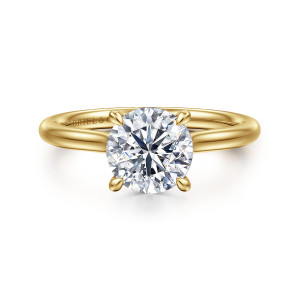 Gabriel & Co. ER16356R6Y44JJ 14 karat yellow gold Classic engagement ring, front view of a round center held by four tapered claw prongs on a smooth band
