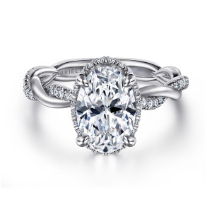 Gabriel & Co. ER16357O8W44JJ 14 karat white gold Contemporary engagement ring, front view of an oval center with a fine diamond edge showing at its rim and twisting shoulders