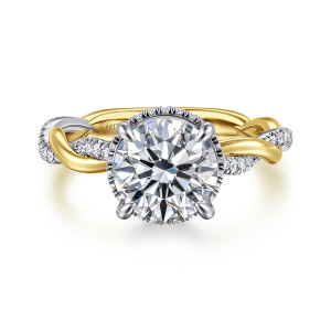 Gabriel & Co. ER16357R8M44JJ 14 karat white and yellow gold Contemporary engagement ring, front view of a round center on claw prongs with the hidden halo just showing past its edge