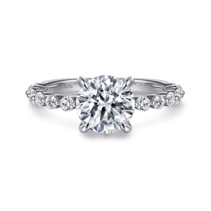 Gabriel & Co. ER16360R6W44JJ 14 karat white gold Classic engagement ring, front view of a round center with four prongs above spaced round diamonds on the shoulders