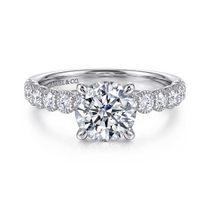 Gabriel & Co. ER16407R6W44JJ 14 karat white gold Classic engagement ring, front view of a round center with four prongs above beaded collars on the shoulders