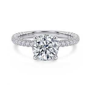 Gabriel & Co. ER16409R6W44JJ 14 karat white gold Classic engagement ring, front view of a round center in claw prongs with diamonds in beaded collars on the band