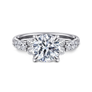 Gabriel & Co. ER16411R8W44JJ 14 karat white gold Contemporary engagement ring, front view of a round center with paired round stones and an elongated stone on each side