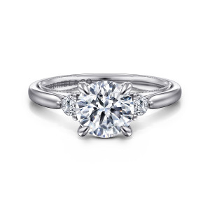 Gabriel & Co. ER16412R6W44JJ 14 karat white gold Classic engagement ring, front view of a round center on four prongs with a round side diamond on each shoulder