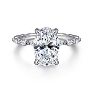 Gabriel & Co. ER16414O8W44JJ 14 karat white gold Contemporary engagement ring, front view of an oval center with elongated stones and tiny beads along each shoulder