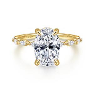 Gabriel & Co. ER16414O8Y44JJ 14 karat yellow gold Contemporary engagement ring, front view of an oval center with elongated stones and tiny beads running out along both shoulders