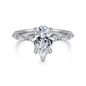 Gabriel & Co. ER16414P6W44JJ 14 karat white gold Contemporary engagement ring, front view of the pear center with a V tip prong and pointed stones along each shoulder