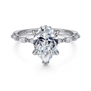 Gabriel & Co. ER16414P8W44JJ 14 karat white gold Contemporary engagement ring, front view of a pear center with elongated stones spaced along the shoulders between small beads