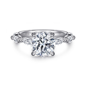 Gabriel & Co. ER16416R6W43JJ 14 karat white gold Contemporary engagement ring, front view of a round center flanked by elongated stones divided by tiny beads