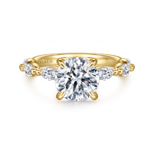 Gabriel & Co. ER16416R6Y43JJ 14 karat yellow gold Contemporary engagement ring, front view of a round center on four prongs beside elongated stones divided by round beads