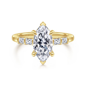 Gabriel & Co. ER16423M6Y44JJ 14 karat yellow gold Contemporary engagement ring, front view of a marquise center with pointed end prongs and bar set baguettes on the band