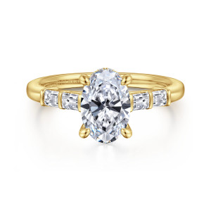 Gabriel & Co. ER16423O6Y44JJ 14 karat yellow gold Contemporary engagement ring, front view of an oval center flanked by baguette diamonds set end to end along the shoulders