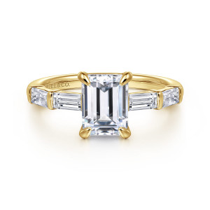 Gabriel & Co. ER16424E6Y44JJ 14 karat yellow gold Contemporary engagement ring, front view of an emerald cut center between baguettes set end to end on each shoulder
