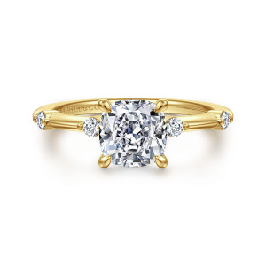 Gabriel & Co. ER16431C6Y44JJ 14 karat yellow gold Contemporary engagement ring, front view of a cushion shaped center flanked by round stones set apart on the band