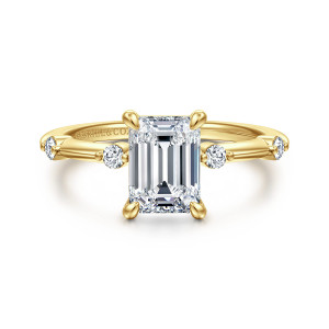 Gabriel & Co. ER16431E6Y44JJ 14 karat yellow gold Contemporary engagement ring, front view of an emerald cut center with claw shaped prongs and small round diamonds beside it
