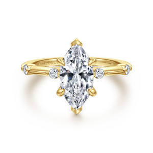 Gabriel & Co. ER16431M6Y44JJ 14 karat yellow gold Contemporary engagement ring, front view of a marquise center with pointed tip prongs and a round diamond at each side