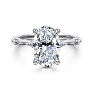 Gabriel & Co. ER16431O12W44JJ 14 karat white gold Contemporary engagement ring, front view of an oval center in four teardrop prongs with round diamonds on each shoulder