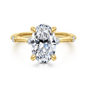Gabriel & Co. ER16431O12Y44JJ 14 karat yellow gold Contemporary engagement ring, front view of an oval center on four claws with small round diamonds at each shoulder