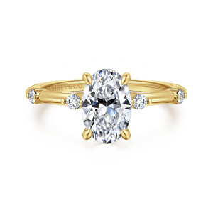 Gabriel & Co. ER16431O6Y44JJ 14 karat yellow gold Contemporary engagement ring, front view of an upright oval center with round diamonds set apart on each shoulder