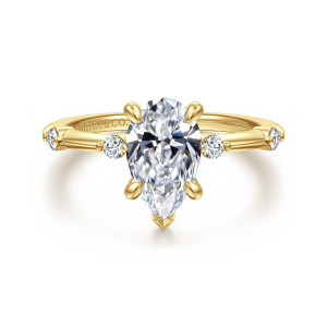 Gabriel & Co. ER16431P6Y44JJ 14 karat yellow gold Contemporary engagement ring, front view of a pear shaped center with a V prong at the tip and round stones