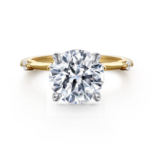 Gabriel & Co. ER16431R12M44JJ 14 karat white and yellow gold Contemporary engagement ring, front view of a round center in claw prongs with a small diamond at each band end