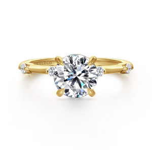 Gabriel & Co. ER16431R6Y44JJ 14 karat yellow gold Contemporary engagement ring, front view of a round center in claw prongs with a small round diamond tucked beside the head