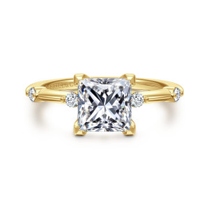 Gabriel & Co. ER16431S6Y44JJ 14 karat yellow gold Contemporary engagement ring, front view of the square princess cut center with corner prongs and a round diamond on each side