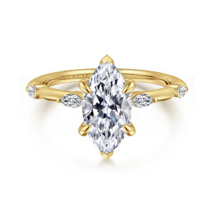 Gabriel & Co. ER16432M6Y43JJ 14 karat yellow gold Starlight engagement ring, front view of a marquise center with pointed tip prongs above a slim band and spaced small stones